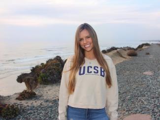 Daniella Walter headshot with ocean background