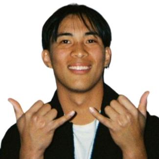 Headshot of a person making shaka hand sign